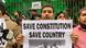 A man in India holds a sign reading Save constitution save country A man in India holds a sign reading Save constitution save country