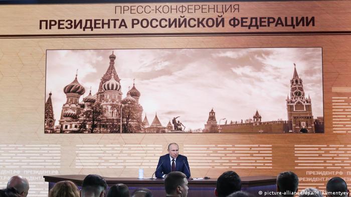 Russian President Vladimir Putin talks to the media during his annual news conference in Moscow, Russia