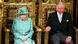 The queen of the UK sits in a green hat and jacket on a golden throne next to the Prince of Wales on the right The queen of the UK sits in a green hat and jacket on a golden throne next to the Prince of Wales on the right