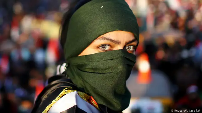 An Iraqi female demonstrator takes part in ongoing anti-government protests in Baghdad (REUTERS/Ahmed Jadallah)
