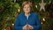 Angela Merkel stands before a Christmas tree Angela Merkel stands before a Christmas tree
