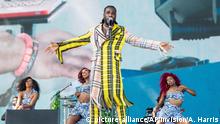 FILE - In this Sunday, April 14, 2019 file photo, Burna Boy performs at the Coachella Music & Arts Festival at the Empire Polo Club in Indio, Calif. Burna Boy was only six years old when Afrobeat pioneer Fela Kuti passed away, but that was enough time for the future musician to be inspired. “Everyone’s got their hero,” said the Port Harcourt, Nigeria native. “For me, that’s my hero.” (Photo by Amy Harris/Invision/AP, File)