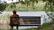 Old woman sits on a bench Old woman sits on a bench