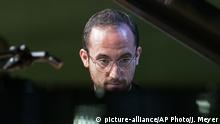 FILE - In this Nov. 9, 2018 file photo, Russian-German pianist Igor levit plays at the Green party convention in Leipzig, Germany. The 32-year-old pianist, winner of last year’s Gilmore Artist Award, is among the most probing young artists in classical music. (AP Photo/Jens Meyer, File) |
