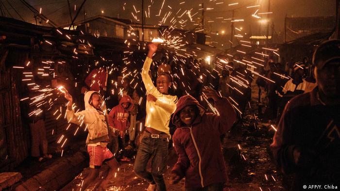 Children celebrate new year in a slum in Nairobi
