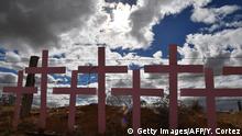 TOPSHOT - Crosses placed in memory of eight victims of feminicide which were found at Lomas del Poleo are pictured on February 19, 2017 in Ciudad Juarez, Chihuahua state, Mexico. For the year 2012, the estimated number of women murdered amounted to more than 700 in Ciudad Juarez where the young women are commonly tortured and raped before they are killed.
Attention Editors: This image is part of an ongoing AFP photo project documenting the life on the two sides of the US/Mexico border simultaneously by two photographers traveling for ten days from California to Texas on the US side and from Baja California to Tamaulipas on the Mexican side between February 13 and 22, 2017. You can find all the images with the keyword : BORDERPROJECT2017 on our wire and on www.afpforum.com / AFP / YURI CORTEZ (Photo credit should read YURI CORTEZ/AFP via Getty Images)