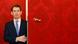 Sebastian Kurz opens a red door at the presidential office in Vienna Sebastian Kurz opens a red door at the presidential office in Vienna