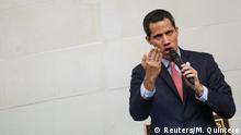 FILE PHOTO: Venezuelan opposition leader Juan Guaido, who many nations have recognised as the country's rightful interim ruler gestures as he speaks during an extraordinary session of Venezuela's National Assembly in Caracas, Venezuela December 17, 2019. REUTERS/Manaure Quintero?/File Photo