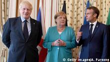 BIARRITZ, FRANCE - AUGUST 24: (L-R) British Prime Minister Boris Johnson, German Chancellor Angela Merkel and French President Emmanuel Macron pose during a G7 coordination meeting with the Group of Seven European members at the Hotel du Palais on August 24, 2019 in Biarritz, France. The French southwestern seaside resort of Biarritz is hosting the 45th G7 summit from August 24 to 26. High on the agenda will be the climate emergency, the US-China trade war, Britain's departure from the EU, and emergency talks on the Amazon wildfire crisis. (Photo by Andrew Parsons - Pool/Getty Images)