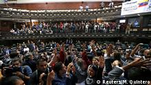 Opposition lawmakers raise their hands after entering the building of Venezuela's National Assembly in Caracas, Venezuela January 5, 2020. REUTERS/Manaure Quintero