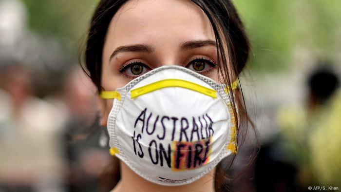 A woman wearing a mask that Australia was on fire.