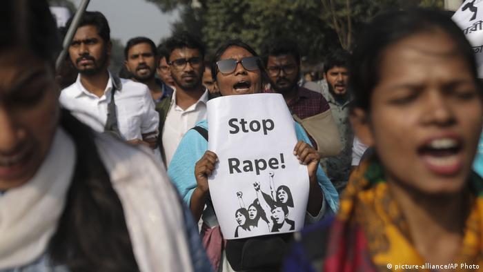 Protesters in Bangladesh carry a sign saying Stop rape