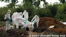 FILE - In this Sunday, July 14, 2019 file photo, an Ebola victim is put to rest at the Muslim cemetery in Beni, Congo. These African stories captured the world's attention in 2019 - and look to influence events on the continent in 2020. (AP Photo/Jerome Delay, File) |
