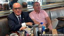 FILE PHOTO: U.S. President Trump's personal lawyer Rudy Giuliani has coffee with Ukrainian-American businessman Lev Parnas at the Trump International Hotel in Washington, U.S. September 20, 2019. REUTERS/Aram Roston/File Photo