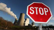 A Stop sign stands in front of the Neurath lignite power plant of German utility RWE, west of Cologne, Germany, January 16, 2020. REUTERS/Wolfgang Rattay