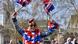 A brexiteer waves union jack flags wearing sunglasses A brexiteer waves union jack flags wearing sunglasses