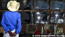 A man looks at the names written on the monument to the victims of El Mozote massacre, executed by the army during El Salvador's 1980-1992 civil war, during a commemoration in El Mozote, 200 km east of San Salvador, on December 7, 2019. - Salvadoreans are commemorating the 38th anniversary of the massacre with the hope that the soldiers accused of the infamous event in which according to official figures 986 people, including 558 children, were killed, are punished. More than 75,000 people were killed or went missing during the country's civil war. (Photo by MARVIN RECINOS / AFP) (Photo by MARVIN RECINOS/AFP via Getty Images)