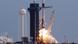 A SpaceX Falcon 9 rocket, carrying the Crew Dragon astronaut capsule, lifts off during a test A SpaceX Falcon 9 rocket, carrying the Crew Dragon astronaut capsule, lifts off during a test
