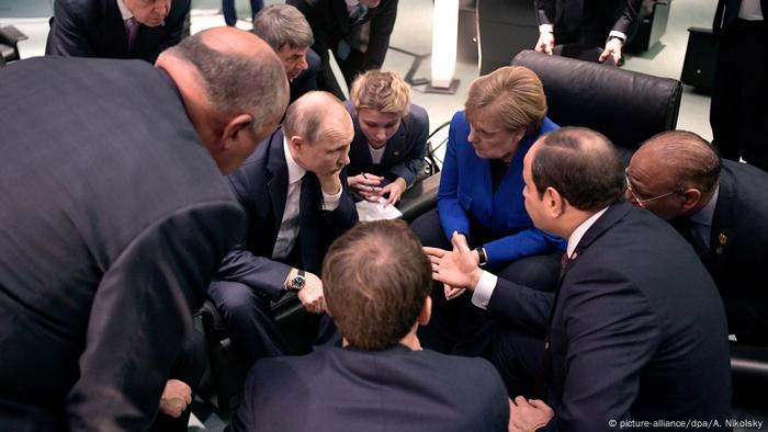 Vladimir Putin, Angela Merkel and Abdel Fattah al-Sisi at a conference on Libya in Berlin