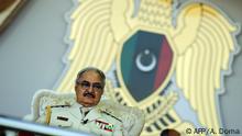 (FILES) In this file photo taken on May 7, 2018, Libyan Strongman Khalifa Haftar attends a military parade in the eastern city of Benghazi, during which he announced a military offensive to take from terrorists the city of Derna, the only part of eastern Libya outside his forces' control. - Libyan strongman Khalifa Haftar, whose forces have been battling to capture the seat of the UN-recognised government in Tripoli since April 2019, has said he is open to dialogue after repeatedly rejecting UN calls for talks. When all is said and done, we need dialogue and we need to sit down at the negotiating table, Hafar said in a statement issued late on September 25 on the eve of a special session on Libya on the sidelines of the UN General Assembly in New York. (Photo by Abdullah DOMA / AFP)