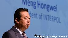 This photo taken on July 4, 2017 shows Meng Hongwei, president of Interpol, delivering an addresses at the opening of the Interpol World Congress in Singapore. - The former Chinese head of Interpol, who went missing last month, was accused of accepting bribes on October 8, becoming the latest top official to fall in President Xi Jinping's anti-corruption dragnet. (Photo by ROSLAN RAHMAN / AFP) (Photo credit should read ROSLAN RAHMAN/AFP via Getty Images)