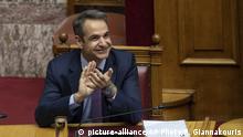 Greek Prime Minister Kyriakos Mitsotakis applaud during a parliamentary session to vote for the new Greek President, in Athens, on Wednesday, Jan. 22, 2019. High court judge Katerina Sakellaropoulou has been elected at Greece's first female president with an overwhelming majority in a parliamentary vote. (AP Photo/Petros Giannakouris) |