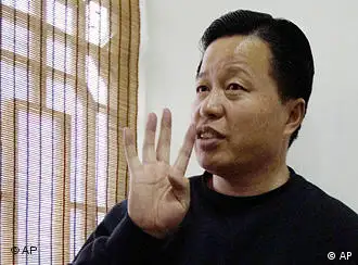 FILE - In this Friday, Feb. 24, 2006 file photo, Gao Zhisheng gestures during an interview at a tea house in Beijing, China. The Chinese human rights lawyer missing for almost a year has been judged by legal authorities and is where he should be, a Foreign Ministry official said in China's first public comment on the case. (AP Photo/Ng Han Guan, File)