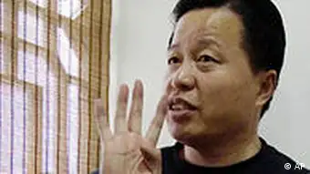 FILE - In this Friday, Feb. 24, 2006 file photo, Gao Zhisheng gestures during an interview at a tea house in Beijing, China. The Chinese human rights lawyer missing for almost a year has been judged by legal authorities and is where he should be, a Foreign Ministry official said in China's first public comment on the case. (AP Photo/Ng Han Guan, File)
