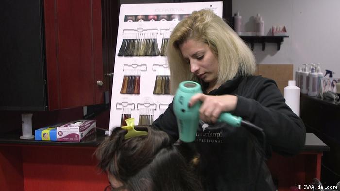 Hairdresser Christina drying the hair of a customer |