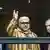 King Mohammed VI of Morocco waves at fans in Amsterdam