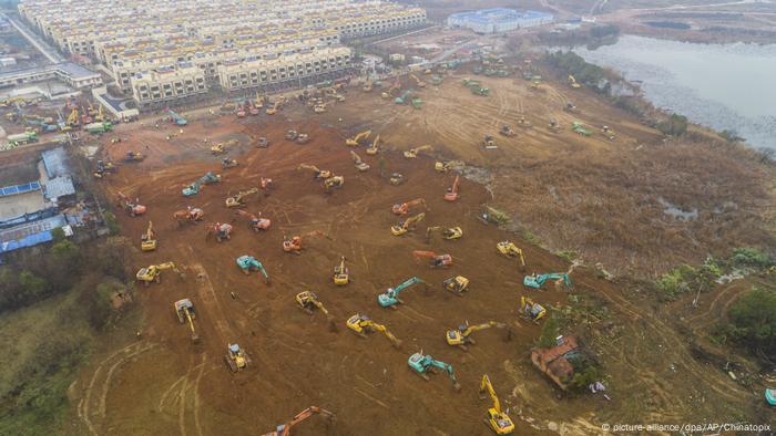 Dozens of excavators are rapidly building a hospital for patients infected with the 2019-nCoV coronavirus in Wuhan.