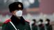 A paramilitary officer wears a mask in Beijing A paramilitary officer wears a mask in Beijing
