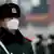 A paramilitary officer wears a mask in Beijing 