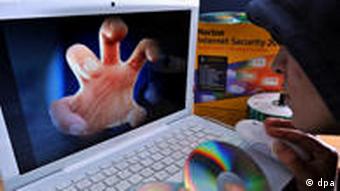 Montage of a hand coming out of computer monitor