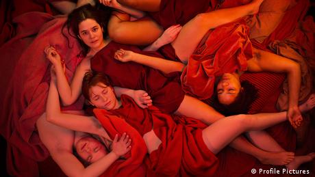 Film still Sex , women lying down, covered by red bits of cloth (Profile Pictures )