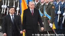 Ukrainian President Volodymyr Zelensky and his Turkish counterpart Recep Tayyip Erdogan review an honour guard during a welcoming ceremony prior to their talks in Kiev on February 3, 2020. (Photo by Sergei SUPINSKY / AFP) (Photo by SERGEI SUPINSKY/AFP via Getty Images)