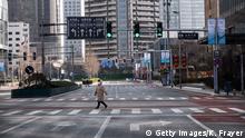 03.02.2020
BEIJING, CHINA - FEBRUARY 03: A pedestrian crosses an empty street at a usually busy intersection in the Central Business District on February 3, 2020 in Beijing, China. China's stock markets tumbled in trading on Monday, the first day back after an extended Lunar New Year holiday as a mystery virus continues to spread in China and worldwide. The number of cases of a deadly new coronavirus rose to more than 17000 in mainland China Monday, days after the World Health Organization (WHO) declared the outbreak a global public health emergency. China continued to lock down the city of Wuhan in an effort to contain the spread of the pneumonia-like disease which medical experts have confirmed can be passed from human to human. In an unprecedented move, Chinese authorities have put travel restrictions on the city which is the epicentre of the virus and neighbouring municipalities, affecting tens of millions of people. The number of those who have died from the virus in China climbed to over 350 on Monday, mostly in Hubei province, and cases have been reported in other countries including the United States, Canada, Australia, Japan, South Korea, India, the United Kingdom, Germany, France and several others. The World Health Organization has warned all governments to be on alert and screening has been stepped up at airports around the world. (Photo by Kevin Frayer/Getty Images)
