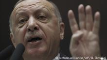Turkey's President Recep Tayyip Erdogan addresses the members of his ruling party at the parliament, in Ankara, Turkey, Wednesday, Feb. 5, 2020. Erdogan threatened to use force against Syrian government forces if they don't pull back to an earlier cease-fire line in northern Syria by the end of the month. Erdogan's remarks followed rare direct clashes Monday between Turkish and Syrian troops inside Syria, which killed several Turkish and Syrian personnel.(AP Photo/Burhan Ozbilici) |