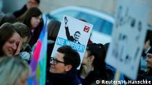 People protest outside the state parliament in Thuringia after FDP candidate Thomas Kemmerich was elected new Thuringia premier in Erfurt, Germany, February 5, 2020. Placard reads Never again. REUTERS/Hannibal Hanschke