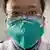 Dr. Li Wenliang wearing a mask