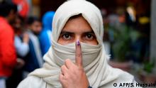 8.2.2020***
TOPSHOT - A woman shows her ink-marked finger after casting her vote at a polling station during the Legislative Assembly elections in New Delhi on February 8, 2020. (Photo by Sajjad HUSSAIN / AFP)