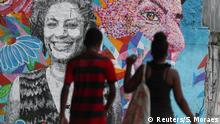 October 30, 2019****
People walk past a wall with an image of murdered activist and councilwoman Marielle Franco, in Rio de Janeiro, Brazil October 30, 2019. REUTERS/Sergio Moraes