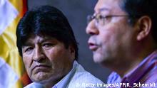 Bolivian presidential candidate for the Movement for Socialism (MAS) party Luis Arce (R), speaks next to Bolivia's ex-President Evo Morales, during a press conference, in Buenos Aires, on January 27, 2020. (Photo by RONALDO SCHEMIDT / AFP) (Photo by RONALDO SCHEMIDT/AFP via Getty Images)