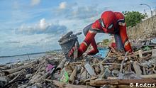 Rudi Hartono, a man dressed in Spiderman costume, collects rubbish at a beach in Pare-Pare, South Sulawesi province, Indonesia, January 18, 2020. Picture taken January 18, 2020. REUTERS/Stringer NO RESALES. NO ARCHIVES