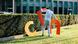 A man trying to assemble the letters C, D and U A man trying to assemble the letters C, D and U