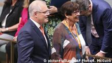 Prime Minister Scott Morrison, center left at front, enters Parliament in Canberra, Australia, on Wednesday, Feb. 12, 2020, with indigenous activist Pat Turner before the prime minister gave a speech on indigenous disadvantage . The Australian government has scrapped a 12-year-old timetable for ending indigenous disadvantage, declaring the policy had failed. (AP Photo/Rod McGuirk) |