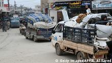 Syrians drive with their belongings as they flee the town of Atme in Syria's northwestern Idlib province, near the Turkish border, on February 12, 2020, following a weeks-long regime offensive against the country's last major rebel bastion. (Photo by Rami al SAYED / AFP) (Photo by RAMI AL SAYED/AFP via Getty Images)