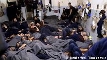 Foreign prisoners, suspected of being part of the Islamic State, lie in a prison cell in Hasaka, Syria, January 7, 2020. REUTERS/Goran Tomasevic SEARCH ISLAMIC STATE PRISONERS FOR THIS STORY. SEARCH WIDER IMAGE FOR ALL STORIES.