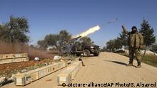 Rebel fighters fire a missile towards Syrian government positions in the province of Idlib, Sunday, Feb. 9, 2020.Syria's military vowed on Sunday to keep up its campaign to regain control of the whole country, days after capturing large chunks of territory from the last rebel holdout in northwestern Syria. (AP Photo/Ghaith Alsayed) |