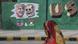 An Indian woman looks at a wall painted with portraits of U.S. President Donald Trump and Indian Prime Minister Narendra Modi ahead of Trump's visit, in Ahmadabad, India, Tuesday, Feb. 18, 2020 An Indian woman looks at a wall painted with portraits of U.S. President Donald Trump and Indian Prime Minister Narendra Modi ahead of Trump's visit, in Ahmadabad, India, Tuesday, Feb. 18, 2020